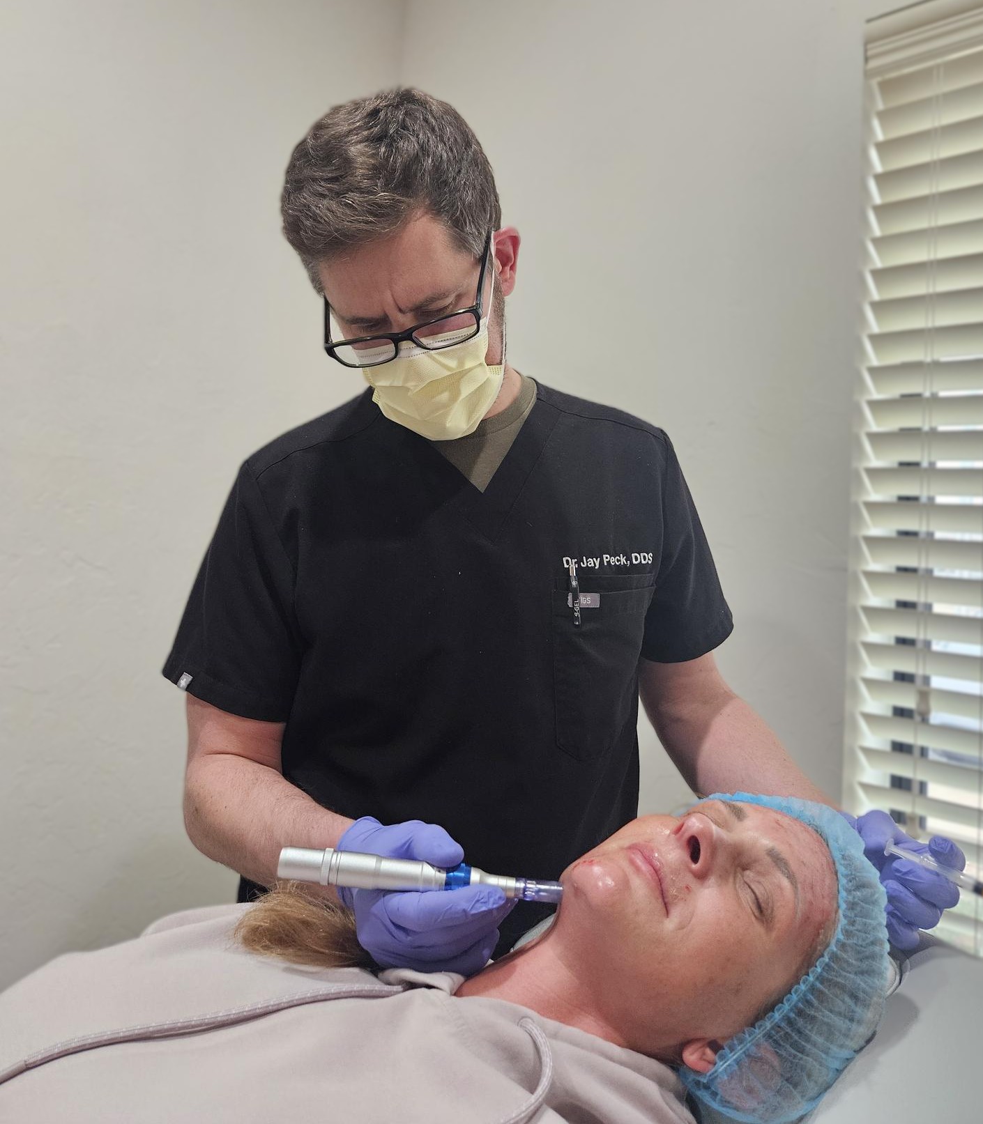 Dr. James Peck, DDS performing an iPRF microneedling facial treatment on a patient at Anagen Medical Institute in Edmond, Oklahoma