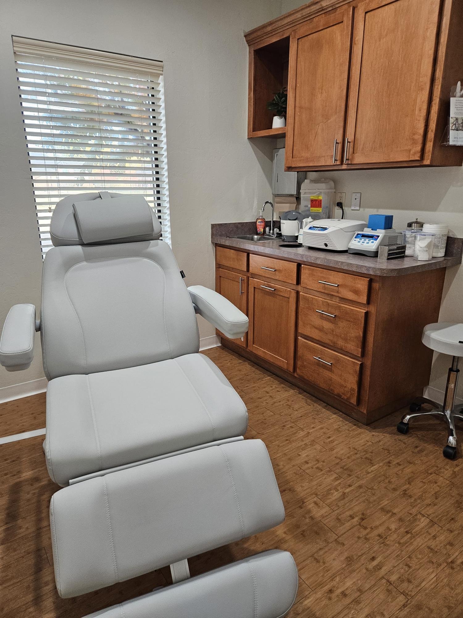 Professional treatment room with advanced medical equipment for regenerative medicine procedures